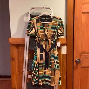 A medium size dress, never worn, tag still on it